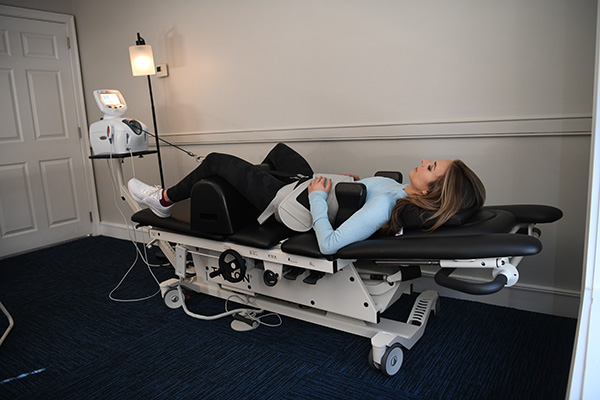 Chiropractic Medway MA Patient On Spinal Decompression Table